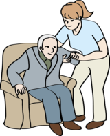 Eine Frau hilft einem älteren Mann aus dem Sesel.