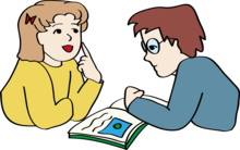 Ein Junge und ein Mädchen lernen mit einem Buch.